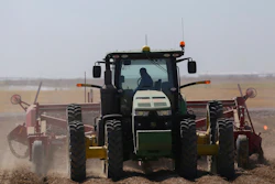 In this Sept. 19, 2018, file photo a tractor operator picks potatoes at Brett Jensen Farms outside of Idaho Falls, Idaho. Image credit: John Roark/The Idaho Post-Register via AP, File