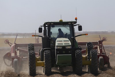 In this Sept. 19, 2018, file photo a tractor operator picks potatoes at Brett Jensen Farms outside of Idaho Falls, Idaho. Image credit: John Roark/The Idaho Post-Register via AP, File