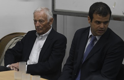 Former Ford Motor Co. executive Pedro Muller, left, who is charged with crimes against humanity for allegedly targeting Argentine union workers for kidnapping and torture after the country's 1976 military coup, awaits sentencing in Buenos Aires, Argentina, Tuesday, Dec. 11, 2018. Image credit: AP Photo/Gustavo Garello