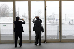 Negotiators at a U.N. climate summit take photos of snow that fell in the morning in Katowice,Poland, Tuesday, Dec. 11, 2018. Image credit: AP Photo/Czarek Sokolowski