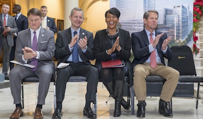 Commissioner of the Georgia Department of Economic Development Pat Wilson, from left, Norfolk Southern CEO Jim Squires, Atlanta Mayor Keisha Lance Bottoms and Georgia Governor-Elect Brian Kemp react to a speaker during a press conference in the Georgia State Capitol building in Atlanta, Wednesday, December 12, 2018. Image credit: Alyssa Pointer/Atlanta Journal-Constitution via AP