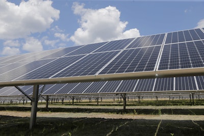 This July 18, 2018, file photo shows a portion of the largest solar installation in New York City in the borough of Staten Island in New York. Image credit: AP Photo/Seth Wenig, File