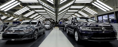 In this Thursday, March 8, 2018 file photo Volkswagen cars are pictured during a final quality control at the Volkswagen plant in Wolfsburg, Germany. Image credit: AP Photo/Michael Sohn, file