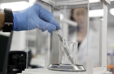In this Wednesday, Aug. 22, 2018, file photo, a marijuana sample is weighed at a cannabis testing laboratory, in Santa Ana, Calif. Image credit: AP Photo/Chris Carlson, File