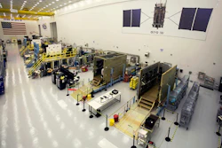 This June 23, 2017 photo provided by Lockheed Martin shows the second GPS III satellite during testing of the deployment of its solar arrays in a clean room at Lockheed Martin's complex south of Denver. Image credit: Pat Corkery/Lockheed Martin via AP