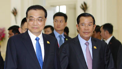 In this Jan. 10, 2018, file photo, China's Premier Li Keqiang, left, heads to the meeting room with his Cambodian counterpart Hun Sen before the opening of the Mekong-Lancang Cooperation forum Leaders Meeting in Phnom Penh, Cambodia. Image credit: AP Photo/Heng Sinith, File
