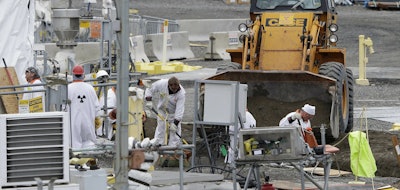 In this March 6, 2013 file photo, workers are shown at the 'C' Tank Farm at the Hanford Nuclear Reservation, near Richland, Wash. Conservation groups are alarmed by the Trump administration's proposal to rename some radioactive waste left from the production of nuclear weapons to make it cheaper and easier to achieve permanent disposal. The U.S. Department of Energy is considering a change in its legal definition of high-level radioactive waste, which is stored at places like the Hanford. (AP Photo/Ted S. Warren)