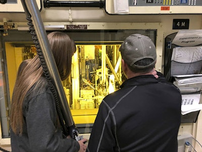 In this Nov. 29, 2018 photo, hot cell operators Dawnette Hunter, left, and Scot White manipulate radioactive material from behind 4-foot-thick leaded glass at the Hot Fuel Examination Facility at the Idaho National Laboratory about 50 miles west of Idaho Falls, Idaho. (AP Photo/Keith Riddler)