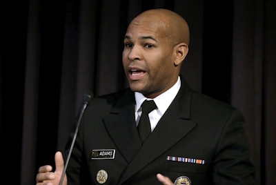 In this Dec. 6, 2018, file photo, United States Surgeon General Jerome Adams addresses an audience during a national summit focused on police efforts to address the opioid epidemic at Harvard Medical School in Boston. Image credit: AP Photo/Steven Senne, File