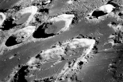 This Dec. 29, 1968 photo made available by NASA shows the large moon crater Goclenius, foreground, approximately 40 statute miles in diameter, and three clustered craters Magelhaens, Magelhaens A, and Colombo A, during the Apollo 8 mission. Image credit: NASA via AP, File