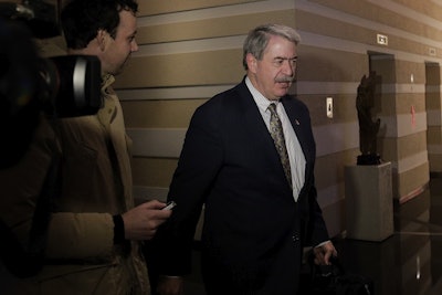 U.S. Undersecretary for Trade and Foreign Agricultural Affairs Ted McKinney is chased by journalists as he walks into a hotel after a second day of meetings with Chinese officials in Beijing, Tuesday, Jan. 8, 2019. Image credit: AP Photo/Andy Wong