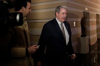 U.S. Undersecretary for Trade and Foreign Agricultural Affairs Ted McKinney is chased by journalists as he walks into a hotel after a second day of meetings with Chinese officials in Beijing, Tuesday, Jan. 8, 2019. Image credit: AP Photo/Andy Wong