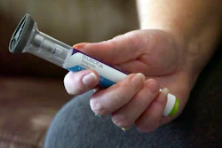 In this July 11, 2018, file photo, Bridgett Snelten holds her Trulicity injection at her home in Sandy, Utah. Image credit: AP Photo/Rick Bowmer, File
