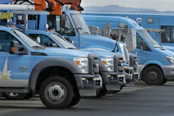 Pacific Gas & Electric vehicles are parked at the PG&E Oakland Service Center, Monday, Jan. 14, 2019, in Oakland, Calif. Facing potentially colossal liabilities over deadly California wildfires, PG&E will file for bankruptcy protection. The announcement today follows the resignation of the power company's chief executive. (AP Photo/Ben Margot)