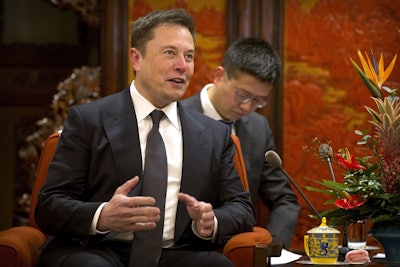 In this Jan. 9, 2019, file photo, Tesla CEO Elon Musk speaks during a meeting with Chinese Premier Li Keqiang at the Zhongnanhai leadership compound in Beijing. Image credit: AP Photo/Mark Schiefelbein, Pool, File