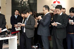 Mitsubishi Motors CEO Osamu Masuko, left, listens to reporters' questions during a press conference at its headquarters in Tokyo Friday, Jan. 18, 2019. Image credit: AP Photo/Eugene Hoshiko