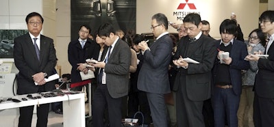 Mitsubishi Motors CEO Osamu Masuko, left, listens to reporters' questions during a press conference at its headquarters in Tokyo Friday, Jan. 18, 2019. Image credit: AP Photo/Eugene Hoshiko
