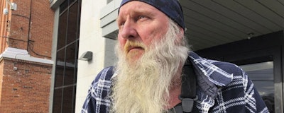 Ray Kemble, left, and Craig Stevens look through papers outside the Susquehanna County Courthouse in Montrose, Pennsylvania, on Feb. 4, 2018. A gas driller backed off its demand to have Kemble, a Pennsylvania homeowner who’s long accused the company of polluting his water, thrown in jail over his failure to submit to questioning as part of the company’s $5 million lawsuit against him. (AP Photo/Michael Rubinkam) (AP Photo/Michael Rubinkam)