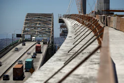 In this July 2, 2018, file photo, traffic moves on the old Gerald Desmond Bridge next to its replacement bridge under construction in Long Beach, Calif. Image credit: AP Photo/Jae C. Hong, File