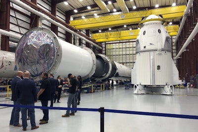 In this Tuesday, Dec. 18, 2018 file photo, SpaceX's Dragon capsule, right, sits in a SpaceX hangar in Cape Canaveral, Fla. Image credit: AP Photo/Marcia Dunn