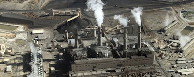 This Nov. 9, 2009, file photo shows the coal-fired San Juan Generating Station near Farmington, N.M. The Legislature will consider a complex bill that could reshape electricity production in New Mexico by phasing out a major coal-fired power plant and boosting state quotas for the production of renewable energy from sources such as wind and solar. The Democrat-sponsored bill was introduced to the New Mexico Legislature on Thursday, Feb. 7, 2019. (AP Photo/Susan Montoya Bryan)