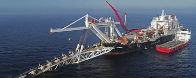In this Nov. 11, 2018 file photo a ship works offshore in the Baltic Sea on the natural gas pipeline Nord Stream 2 from Russia to Germany. (Bernd Wuestneck/dpa via AP)