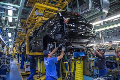 Ford employees assemble a vehicle in Valencia, Spain. Image credit: Ford Motor co.