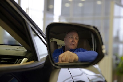 Howard Hakes, chairman of the American International Automobile Dealers Association, poses in a 2019 Toyota RAV4 manufactured in Japan at his dealership Thursday, Feb. 14, 2019, in Industry, Calif. Image credit: AP Photo/Jae C. Hong