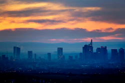 An orange sky is seen over the banking district of Frankfurt, Germany, on Tuesday, Feb. 26, 2019. Image credit: AP Photo/Michael Probst