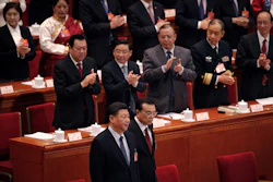 Leaders applaud as Chinese President Xi Jinping, foreground left, and Chinese Premier Li Keqiang, foreground right, arrive at the opening session of the China's National People's Congress at the Great Hall of the People in Beijing, Tuesday, March 5, 2019. Image credit: AP Photo/Andy Wong