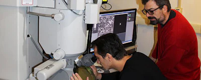 This is Osman El Atwani (left) and Enrique Martinez at the transmission electron microscope. (Los Alamos National Laboratory)