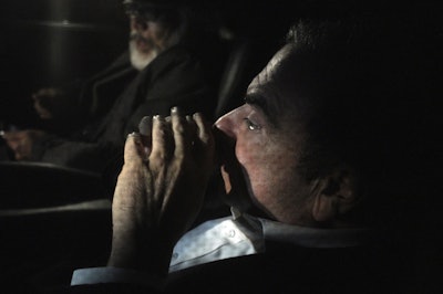 Former Nissan chairman Carlos Ghosn, front, travels in a car Wednesday, March 6, 2019, in Tokyo, after posting 1 billion yen ($8.9 million) in bail once an appeal by prosecutors against his release was rejected. Image credit: AP Photo/Eugene Hoshiko