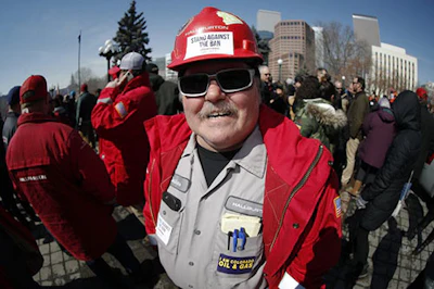 Frank Deshane of Brighton, Colo., takes part in a rally outside the state Capitol in Denver on Tuesday, March 5, 2019, in opposition of lawmakers' plan to advance a bill to overhaul the state's oil and gas regulations. (AP Photo/David Zalubowski)
