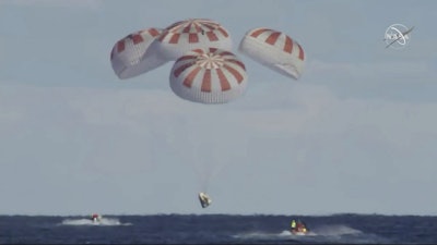 This image provided by NASA shows SpaceX's Dragon capsule carrying a test dummy splashed down into the Atlantic ocean off the Florida coast, Friday, March 8, 2019. Image credit: NASA via AP