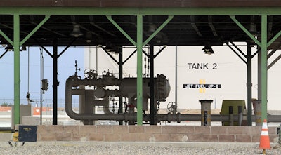 This Aug. 7, 2014, image shows one of the jet fuel tanks at Kirtland Air Force Base in Albuquerque, N.M. The fueling station was replaced with above-ground equipment in 1999 after the base uncovered an underground leak that resulted in millions of gallons of jet fuel finding its way in the soil and groundwater below the site. (AP Photo/Susan Montoya Bryan)