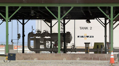 This Aug. 7, 2014, image shows one of the jet fuel tanks at Kirtland Air Force Base in Albuquerque, N.M. The fueling station was replaced with above-ground equipment in 1999 after the base uncovered an underground leak that resulted in millions of gallons of jet fuel finding its way in the soil and groundwater below the site. (AP Photo/Susan Montoya Bryan)