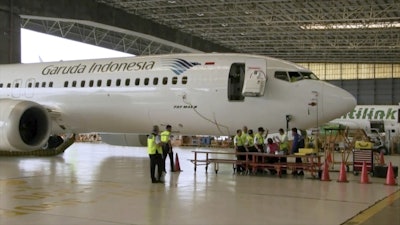 In this image from video taken on Tuesday, March 12, 2019, a Boeing 737 Max 8 aircraft is in hangar before the inspection at Garuda Maintenance Facility at Soekarno Hatta airport, Jakarta. Image credit: AP Photo