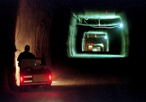 In this April 8, 1998, file photo, a worker drives a cart through a tunnel inside the Waste Isolation Pilot Plant No. 2, 150 feet below the surface near Carlsbad, N.M. Image credit: AP Photo/Eric Draper, File