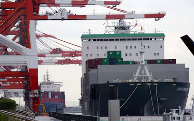 In this June 18, 2018, file photo, a container ship, right, arrives at a container terminal in Tokyo. Image credit: AP Photo/Koji Sasahara, File