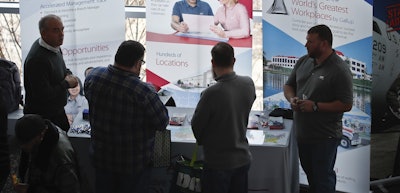 In this March 7, 2019, file photo visitors to the Pittsburgh veterans job fair meet with recruiters at Heinz Field in Pittsburgh. Image credit: AP Photo/Keith Srakocic, File