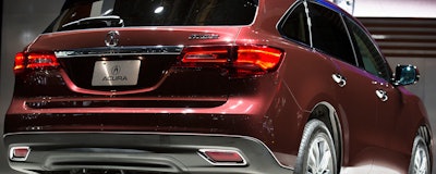 In this Wednesday, March 27, 2013, file photo, the 2014 Acura MDX is unveiled during the New York International Auto Show at the Jacob K. Javits Convention Center, in New York. Honda's luxury brand Acura is recalling more than 360,000 SUVs worldwide because water can get into the tail lights and make them go dark. The recall is mostly in North America and covers the MDX from the 2014 through 2019 model years. (AP Photo/John Minchillo)