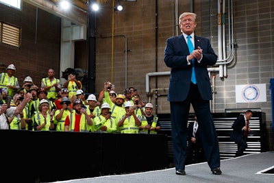 President Donald Trump arrives to speak about energy and infrastructure at the International Union of Operating Engineers International Training and Education Center, Wednesday, April 10, 2019, in Crosby, Texas. (AP Photo/Evan Vucci)