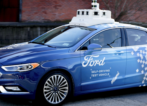 In this Dec. 18, 2018, photo, one of the test vehicles from Argo AI, Ford's autonomous vehicle unit, navigates through the strip district near the company offices in Pittsburgh. Image credit: AP Photo/Keith Srakocic