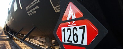 This Nov. 6, 2013, file photo, shows a warning placard on a tank car carrying crude oil near a loading terminal in Trenton, N.D. North Dakota officials are pressuring the state of Washington to back off from legislation requiring oil shipped by rail to have more of its volatile gases removed. Proponents of the bill awaiting Gov. Jay Inslee's signature say it will boost safety, but North Dakota officials worry it could hamper the nation's No. 2 oil producer. North Dakota's three members of Congress have asked Inslee to veto the bill. North Dakota regulators are considering a lawsuit. (AP Photo/Matthew Brown)