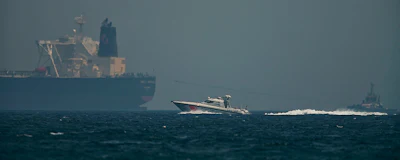 An Emirati coast guard vessel passes an oil tanker off the coast of Fujairah, United Arab Emirates, Monday, May 13, 2019. Saudi Arabia said Monday two of its oil tankers were sabotaged off the coast of the United Arab Emirates near Fujairah in attacks that caused 'significant damage' to the vessels, one of them as it was en route to pick up Saudi oil to take to the United States. (AP Photo/Jon Gambrell)