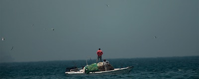 A fishing boat sails in waters off the coast of Fujairah, United Arab Emirates, Monday, May 13, 2019. Saudi Arabia said Monday two of its oil tankers were sabotaged off the coast of the United Arab Emirates near Fujairah in attacks that caused 'significant damage' to the vessels, one of them as it was en route to pick up Saudi oil to take to the United States. (AP Photo/Jon Gambrell)