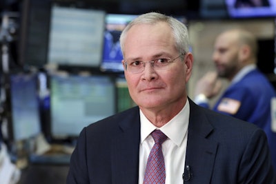 In this Wednesday, March 1, 2017, photo, Exxon Mobil Chairman & CEO Darren Woods sits for an interview on the floor of the New York Stock Exchange. Image credit: AP Photo/Richard Drew, File