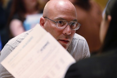 n this Tuesday, June 4, 2019 photo, job applicant Juan Ramon Velazquez answers questions as he is called up at the Seminole Hard Rock Hotel & Casino Hollywood during a job fair in Hollywood, Fla. Image credit: AP Photo/Wilfredo Lee