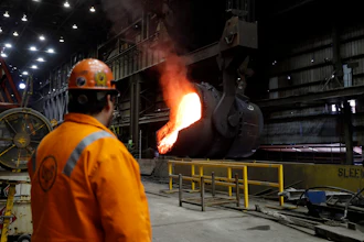 In this June 28, 2018 file photo, senior melt operator Randy Feltmeyer watches a giant ladle as it backs away after pouring its contents of red-hot iron into a vessel in the basic oxygen furnace as part of the process of producing steel at the U.S. Steel Granite City Works facility in Granite City, IL.
