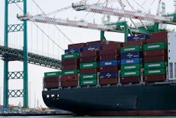 In this June 19, 2019 file photo, a cargo ship is docked at the Port of Los Angeles in Los Angeles.